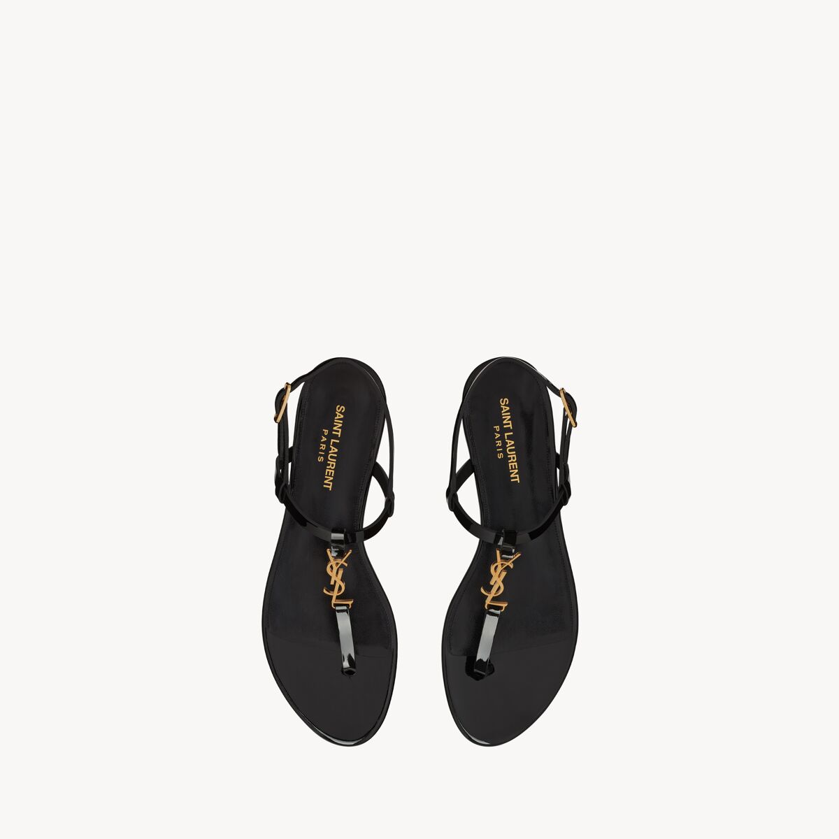 Saint Laurent Flache Cassandra Sandalen Aus Lackleder Mit Goldfarbenem Monogramm - Schwarz - Damen - 38.5